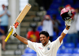 Ramnaresh Sarwan of the West Indies celebrates after completing his century on the second day of the third Test against India at Basseterre