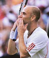 Andre Agassi of the USA celebrates after beating Italy�s Andreas Seppi in the second round at Wimbledon in London on Thursday. Agassi won 6-4, 7-6, 6-4.