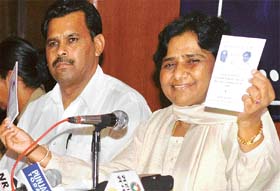 Bahujan Samaj Party chief Mayawati displays a booklet on reservation in Jalandhar