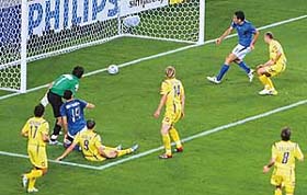Italian forward Luca Toni (blue jersey, right) scores the third goal during the quarterfinal match against Ukraine in Hamburg