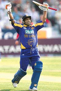 Sri Lanka's Sanath Jayasuriya celebrates after hitting a century against England during the fifth one day in London