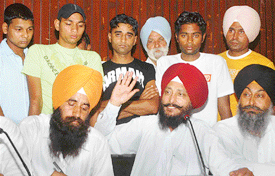 Five youths, who were rescued from Morocco for possessing fake visas provided by travel agents, being presented by Lok Bhalai Party leaders during a press conference in Jalandhar on Sunday.