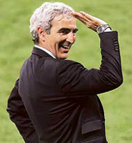 French coach Raymond Domenech celebrates after his team beat Portugal 1-0 in the semifinal in Munich on Wednesday; France�s Zinedine Zidane.