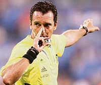 Uruguayan referee Jorge Larrionda gestures during the Portugal-France semifinal. 