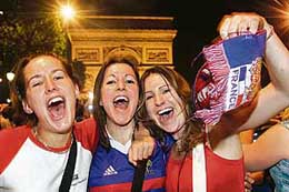 French fans celebrate on the Champs-Elysees in Paris after their team beat Portugal on Wednesday.