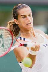 Amelie Mauresmo of France plays a shot against Belgium�s Justine Henin-Hardenne in the women�s singles final at Wimbledon on Saturday. 