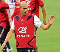 Zinedine Zidane waves to the public at a training camp in Aerzen on Friday. 