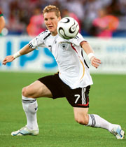 German midfielder Bastian Schweinsteiger eyes the ball during the match third place Portugual in Stuttgart on Saturday. 