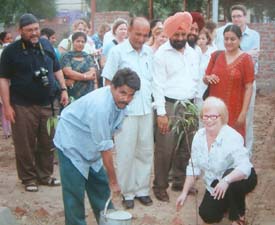 One of the members of the team of teachers from the USA plants a sapling during a visit to the Government ITI for Women in Amritsar