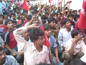 Migrant labourers protest in front of the office of SP in Pathankot on Thursday.