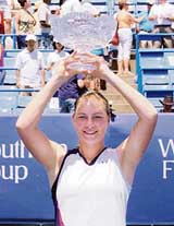Vera Zvonareva of Russia holds the trophy after defeating Katarina Srebotnik of Slovenia in the final of the Cincinnati Open tennis tournament in Ohio on Sunday