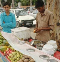 Creating conducive environment: Nimbu-paani (L) and fruits chaats at the road sides help the disease germs thrive and propagate, leading to various communicable diseases during the rains. 