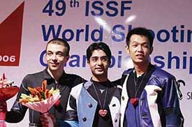 Alin George Moldoveanu of Romania  Abhinav Bindra (center) and Qinan Zhu of China celebrate on the podium after the 10 m Air rifle competition at the 49th ISSF (International Shooting Sport Federation) World Shooting Championship in Zagreb, Croatia, on Monday