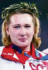 Women�s Olympics discus throw gold medal winner Natalia Sadova of Russia poses on the podium during the 2004 Athens Olympic Games. Sadova has been banned for two years after failing a drugs test, athletics� world governing body IAAF said on Tuesday