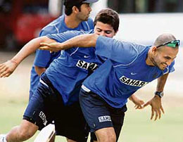 Irfan Pathan (right) enjoys a light moment with team-mates Suresh Raina (centre) and Wasim Jaffar during a practice session at the National Cricket Academy in Bangalore on Tuesday.
