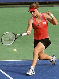 Samantha Stosur of Australia hits a forehand against Nathalie Dechy of France at the Acura Classic in Carlsbad, California, on Monday. Stosur won 7-5, 6-4.
