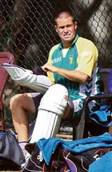 South Africa�s Andrew Hall puts on his pads during a practice session at the R. Premadasa Stadium in Colombo on Thursday