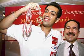 World shooting champion Manavjit Sandhu (left) with Sameer Thapar, Vice-Chairman & MD, JCT Ltd, during a press conference in New Delhi on Thursday