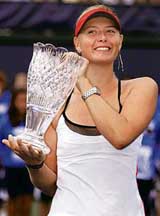 Russia�s Maria Sharapova holds the trophy after defeating Kim Clijsters of Belgium in the final of the Acura Classic tennis tournament in Carlsbad, California, on Sunday. Sharapova won 7-5, 7-5.