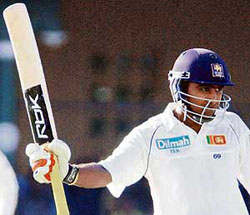 Sri Lankan Mahela Jayawardene celebrates his half century during the fourth day of the second Test against South Africa in Colombo on Monday.