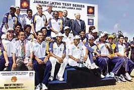 The Sri Lankan cricket team with the spoils of victory after winning the second Test, and the series, against South Africa in Colombo on Tuesday.