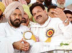 Mr Shamsher Singh Dullo, PPCC president, and Dr Raj Kumar, MLA, Verka, at a Congress rally at Vallah in Amritsar on Thursday.