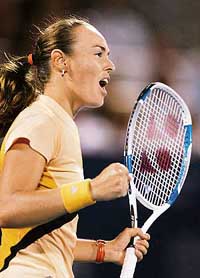 Switzerland�s Martina Hingis celebrates winning a point during her pre-quarterfinal against Slovakia�s Daniela Hantuchova at the Rogers Cup in Montreal on Thursday. Hingis won 7-5, 6-4. 