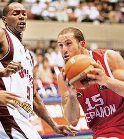 Lebanon�s Fadi El Khatib gets past Venezuela�s Oscar Torres during their opening game at the World Basketball Championships in Sendai, Japan