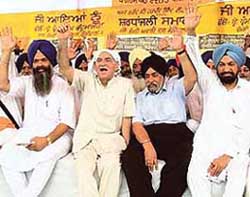 (From left) SAD (Longowal) president Prem Singh Chandumajra, former Delhi Chief Minister Madan Lal Khurana, former DSGMC president Paramjeet Singh Sarna and Lok Bhalai Party president B.S. Ramoowalia at a conference of the SAD (Longowal) at Longowal village on Sunday.
