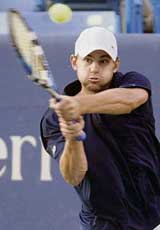 Andy Roddick of the USA hits a return to Chile�s Fernando Gonzalez during the semifinal of the Cincinnati Masters tennis tournament in Mason, Ohio, on Saturday