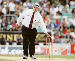 Darrell Hair removes the bails