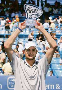 Andy Roddick of the USA lifts the trophy after defeating Spain�s Juan Carlos Ferrero 6-3, 6-4 in the final of the Cincinnati Masters tennis tournament in Mason, Ohio, on Sunday. 