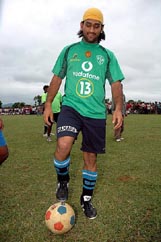 Mahendra Singh Dhoni kicks the ball during an exhibition match near Ranchi on Wednesday. 