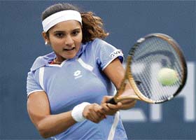 Sania Mirza plays a return to Italy�s Francesca Schiavone during their second-round match at the US Open in New York