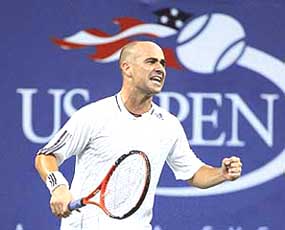 Andre Agassi of the US exults during his second-round match against Marcos Baghdatis of Cyprus at the US Open in New York on Thursday. Agassi won 6-4, 6-4, 3-6, 5-7, 7-5.