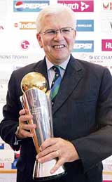 International Cricket Council Chief Executive Malcolm Speed holds the ICC Champions Trophy at a press conference in Mumbai on Thursday