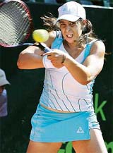 Marion Bartoli of France hits a return against Ayu Fani Damayanti of Indonesia during the Wismilak International-2006 tournament in Nusa Dua, Bali, on Monday. Bartoli won 6-1, 6-0.