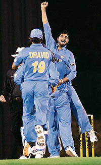 Harbhajan Singh is hugged by team-mates after he took a wicket during India�s tri-series ODI match against the West Indies in Kuala Lumpur on Wednesday.