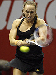 Martina Hingis of Switzerland returns a shot to Tzipora Obziler of Israel during a pre-quarterfinal match at the Sunfeast Open in Kolkata on Wednesday. Hingis won 6-2, 7-5. 
