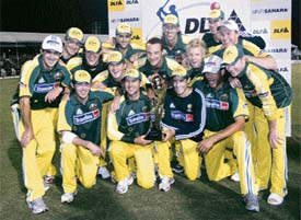 Australian players pose with the DLF trophy after beating the West Indies in the final of the tri-series in Kuala Lumpur on Sunday