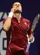 Russia�s Marat Safin celebrates after defeating Germany�s Mischa Zverev in the quarterfinal of the Thailand Open tennis tournament in Bangkok on Friday