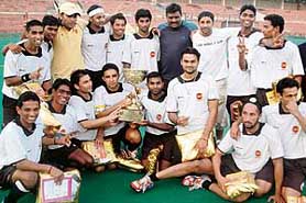 Players of Indian Oil Corporation pose with the trophy after defeating Bharat Petroleum Corporation Limited in the final of SN Vohra�s 36th All-India Gurmit Memorial Hockey Tournament at the Sector 42 hockey stadium in Chandigarh on Monday.