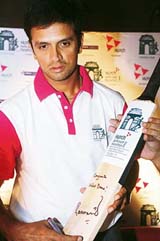 Rahul Dravid holds a bat signed by him at a press conference organised for the Hutch Delhi half marathon 2006, in New Delhi 