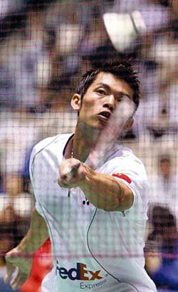 World champion Lin Dan of China plays a return to Taufik Hidayat of Indonesia during the men�s singles final of the Japan Open badminton tournament in Tokyo on Sunday