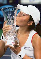 Vania King of the USA kisses the trophy after beating Thailand�s Tamarine Tanasugarn 2-6, 6-4, 6-4 in the final of the Bangkok Open women�s tennis tournament on Sunday