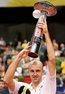 Ivan Ljubicic of Croatia lifts the trophy after beating Chile�s Fernando Gonzalez in the final of the Vienna Open on Sunday. Ljubicic won 6-3, 6-4, 7-5.