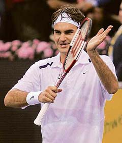 Switzerland�s Roger Federer celebrates after beating Chile�s Nicolas Massu in the second round at the Madrid Masters Series in Madrid 
