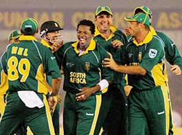 South Africa�s Makhaya Ntini (centre) is congratulated by his team-mates after taking a Pakistani wicket during their Group B match at the PCA Stadium in Mohali on Friday. 
