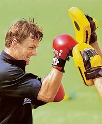 Australian wicketkeeper Adam Gilchrist boxes during a training session in Mohali