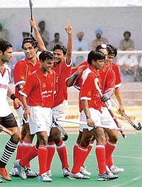 Delhi players celebrate after defeating Air-India in the 62nd National Hockey Championship in Jalandhar
